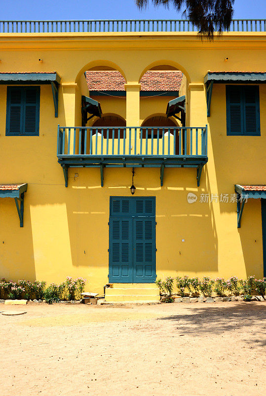 Yellow façade of the Aga Khan building, Island of Gorée, Dakar, Senegal